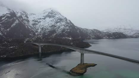 Rotating-movement-from-the-Lofoten-road-bridge-towards-the-snow-covered-mountain