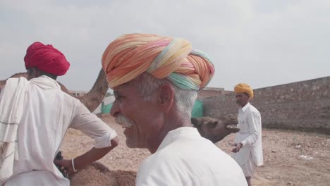 Group-of-Indian-men-and-their-camels-in-the-desert-of-Rajasthan