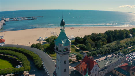 Drone-flying-from-Sopot-towards-baltic-sea-with-pier-in-the-background-at-sunny-summer-day