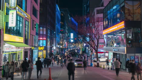 People-Shopping-at-Myeongdong-Night-Market-Street-in-Seoul,-South-Korea---zoom-in-timelapse