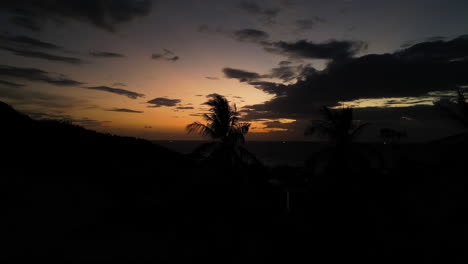 Beautiful-Sunset-Sky,-Exotic-Palm-Trees,-And-Coastal-Twilight-Over-The-Tropical-Island-Of-Koh-Tao,-Thailand