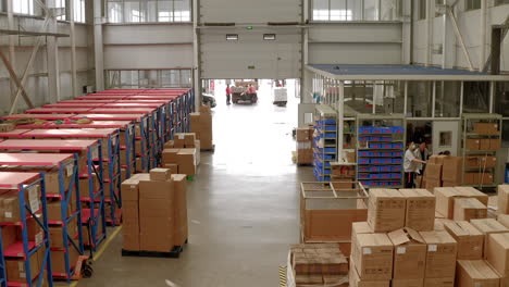 Workers-are-busy-packing-and-organising-at-a-Chinese-factory's-warehouse