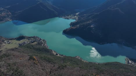 Aerial-Up-forward-Right-Reveal-Drone-shot-of-Ledro-Lake-from-Monte-Cocca---Not-Graded