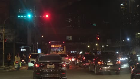 Slow-movement-of-traffic-during-the-night-in-a-rush-hour-in-Bangkok-down-Ratchada-road,-Thailand