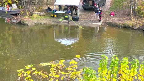 Police-officer-search-team-use-tethered-underwater-robot-to-search-Sabattus-and-Androscoggin-River-at-Pejepscot-boat-ramp