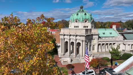 Handley-Regional-Library-with-American-flag-and-autumn-leaves