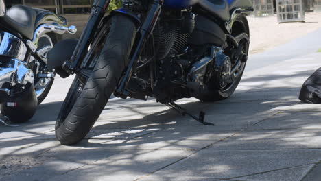 Harley-Davidson-Motorbikes-Out-Front-Of-Local-Cafe-On-A-Sunny-Day