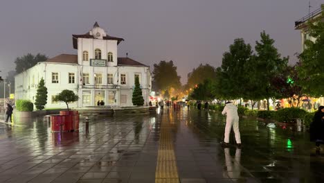 Asia-tourist-landmark-spring-season-travel-destination-in-a-rainy-day-nightlife-walking-street-in-Rasht-the-city-of-Authentic-delicious-food-local-people-in-Iran-twilight-dark-cobble-stone-pavement