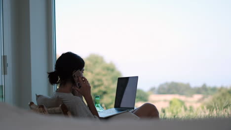 Remote-Work:-Woman-with-Laptop-and-Phone-in-Nature-Home-Office