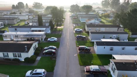 Sunrise-over-a-tranquil-suburban-street-lined-with-mobile-homes-in-trailer-park