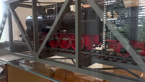 Close-up-shot-of-model-steam-loco-with-steel-rail-in-villa-hügel-museum-of-family-krupp-thyssenkrupp