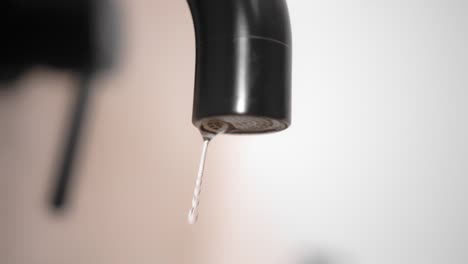 Drop-of-pure-water-dripping-from-modern-tap