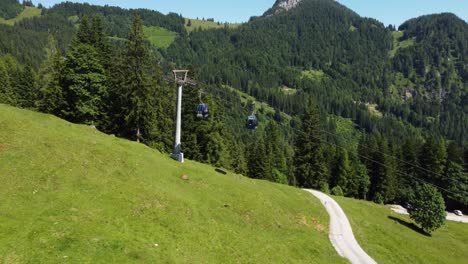 Steep-rope-way-leading-up-a-mountain-in-the-Alps-in-Lofer,-Austria