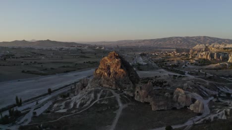 aerial-view-phone-camera-moving-forward-where-a-large-rock-is-visible