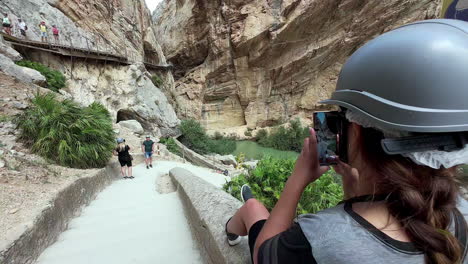 Female-tourist-taking-photos-at-El-Cabrito-ornithological-observatory,-Gibraltar