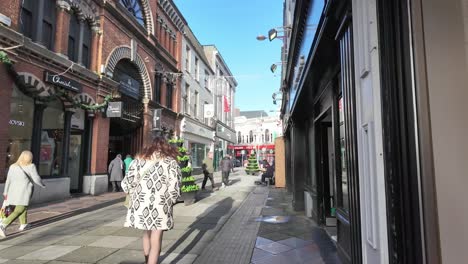 Pedestrians-in-slow-motion-on-the-street-of-Cork-City,-Ireland-near-English-market