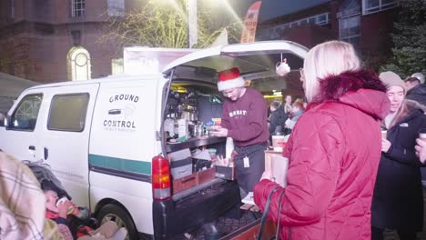 Customers-line-up-to-purchase-hot-chocolate-and-coffee-from-mobile-seller