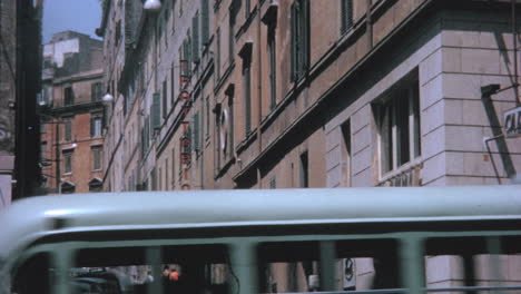 People-Walk-Along-the-Narrow-Via-Zucchelli-in-Summer-in-Rome-in-the-1960s