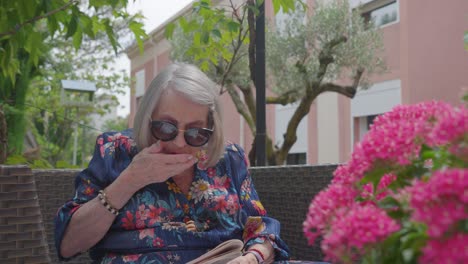 Grandmother-Reading-Outdoors-in-French-Retirement-Home