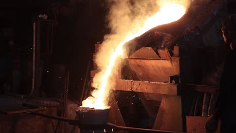 pov-shot-high-degree-Celsius-iron-is-melting-and-sparking-out