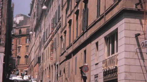 Traffic-and-pedestrians-on-Via-Zucchelli-Under-a-Blue-Sky-in-Rome-in-the-1960s