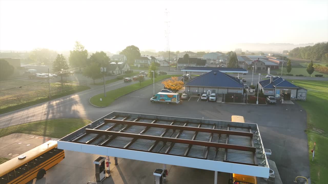 Yellow School Buses Refueling At Small Town Gas Station After Morning ...