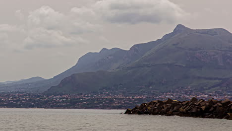 The-captivating-landscape-of-Sicily,-Italy,-offers-a-remarkable-time-lapse-view-that-seamlessly-integrates-with-the-moving-clouds-as-they-glide-through-the-sky