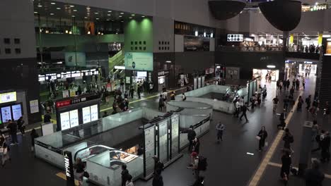 People-walking-through-the-Kyoto-station-at-night