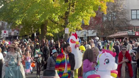 People-in-costumes-like-unicorns-and-chickens-walk-the-streets