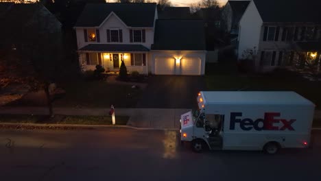 FedEx-delivery-truck-on-a-residential-street-at-dusk