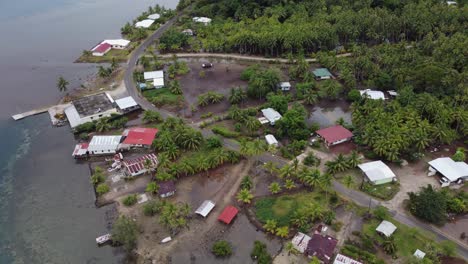 Aerial-rotates-over-wet-tropical-coastline-of-Taha'a-Island,-Polynesia
