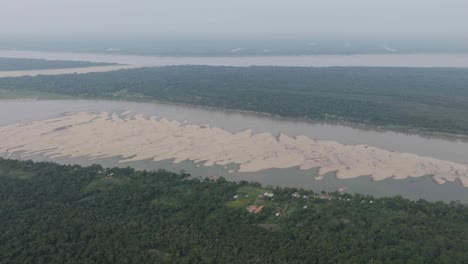 Sand-accumilation-on-dry-river-in-extreme-drought-in-the-Amazon-Rainforest,-aerial-shot