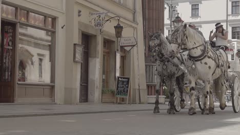 Cinematic-Footage:-Carriage-Riding-Through-Krakow-Streets
