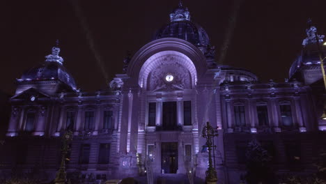 Victory-Avenue-CEC-Palace-illuminated,-snowing,-Bucharest-Romania