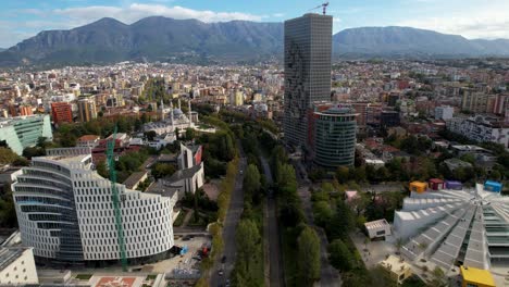 Heritage-and-Modernity:-Tirana's-Pyramid,-Architectural-Marvels,-Church-and-Mosque,-Religious-Icons-Along-the-Lana-River