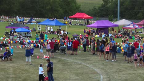 People-crowded-around-cross-country-course-at-meet