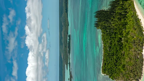 Ilot-Moro-in-New-Caledonia-famous-tourist-attraction---vertical-aerial-flyover-hyper-lapse
