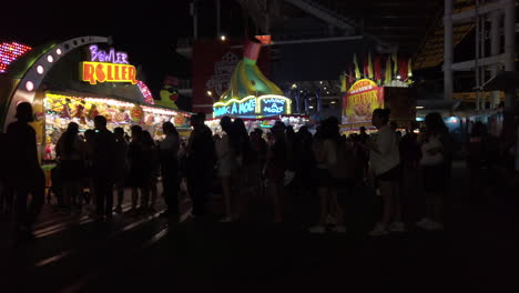 A-night-time-crowd-lined-up-and-waiting-for-tickets-at-the-Canadian-National-Exhibition