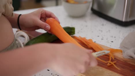 Slicing-carrot-finely-using-universal-peeler