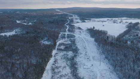 Winter-Forest-Deforestation,-Cleared-for-Electrical-Power-Lines,-Aerial