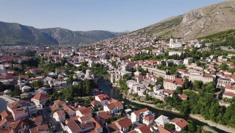 Aerial-orbit-Mostar,-Bosnia-and-Herzegovina,-Balkan-city-panorama-in-Summer