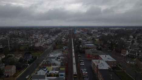 An-aerial-view-of-a-Long-Island-railroad-train-traveling-on-a-cloudy-day