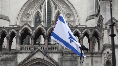 Israeli-flag-is-flown-infant-of-the-Royal-Courts-of-Justice-in-London,-UK