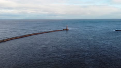 Aerial-of-Roker-lighthouse-and-pier-with-calm-ocean