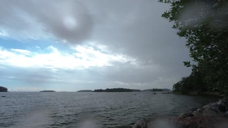 Time-lapse-of-storm-clouds-rolling-in-the-sky-over-a-lake