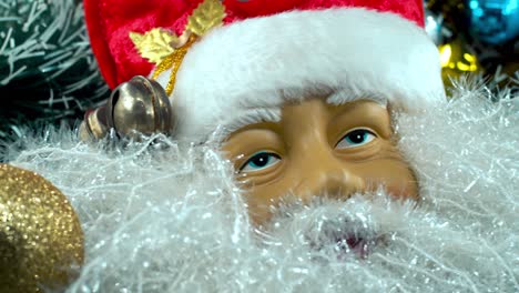 Detailed-close-up-smooth-pan-left-shot,-Santa-Claus-toy-in-a-red-hat,-Christmas-decoration,-traditional-holiday-gifts,-new-year-decor,-retro-gifts,-4K-video