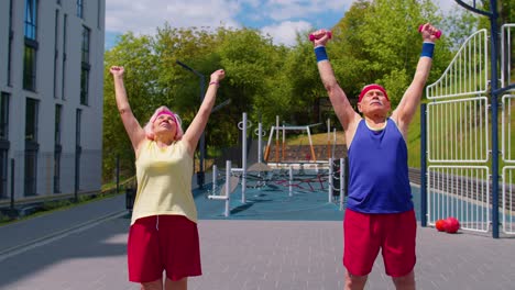 Elderly-grandmother-and-grandfather-pensioners-family-engaged-in-sports-doing-stretching-cardio