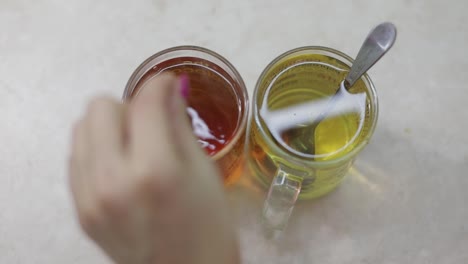 Close-video-of-making-a-cup-of-black-tea-with-a-fresh-tea-bag-in-hot-water