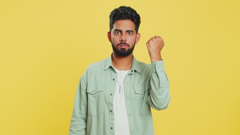 Aggressive-angry-Indian-man-trying-to-fight-at-camera,-shaking-fist,-boxing,-punishment,-threaten