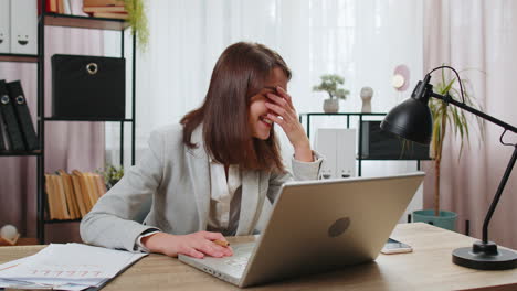 Nervous-stressed-businesswoman-manager-quarrelling-laptop-call-online-talking-aggressively-at-office